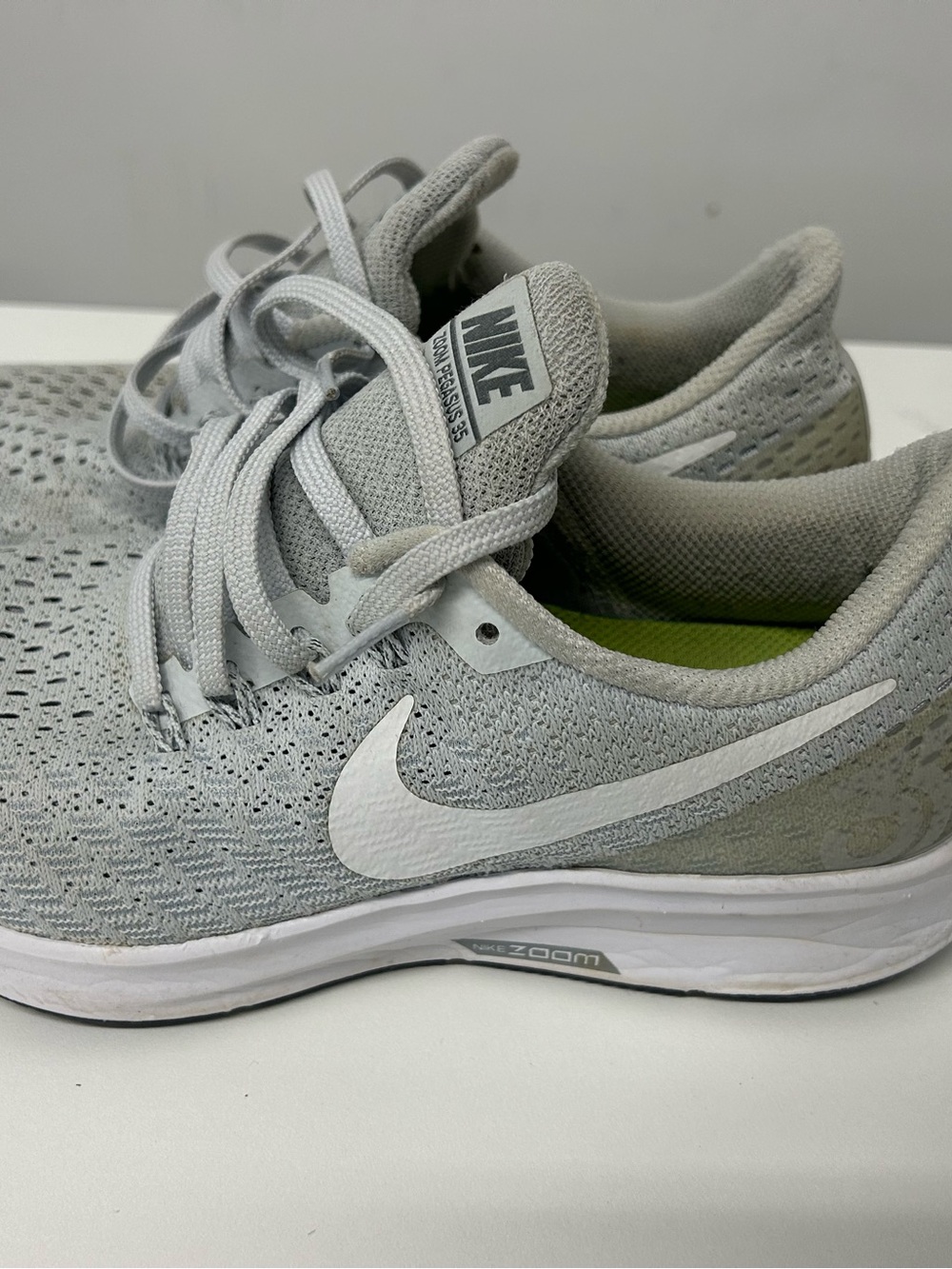 Nike women’s Light Gray and White Zoom Running Sneakers